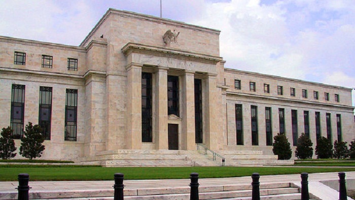 Fed holds interest rates steady, downplays economic weakness